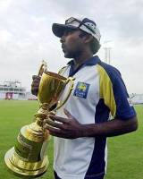 Mahela Jayawardene poses with the trophy as Sri Lanka took the series 2-0 against Bangladesh © AFP