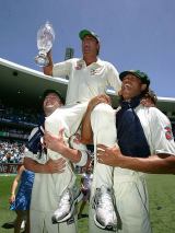 Michael Clarke and Andrew Symonds chair Shane Warne off the SCG after Australia completed their series whitewash © Getty Images