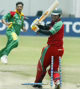 Brendan Taylor drags on his pull to hand Mashrafe Mortaza a third wicket during Bangladesh's tense one-wicket win at Harare © AFP