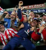 Paul Nixon dives into the Barmy Army as he savours England's victory at Sydney which clinched the CB Series © Getty Images