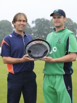 Jeroen Smits and William Porterfield share the trophy after the final was washed out in Belfast © AFP