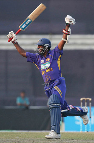 A delighted Muttiah Muralitharan celebrates a remarkable two-wicket win for Sri Lanka over Bangladesh in Mirpur © AFP